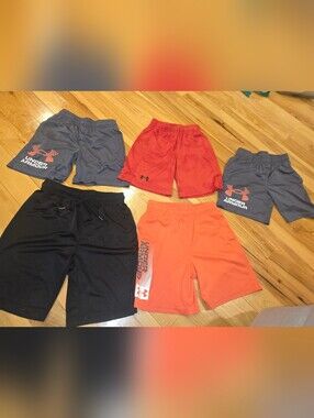 5 boys athletic shorts,  mostly under armour, size small and medium